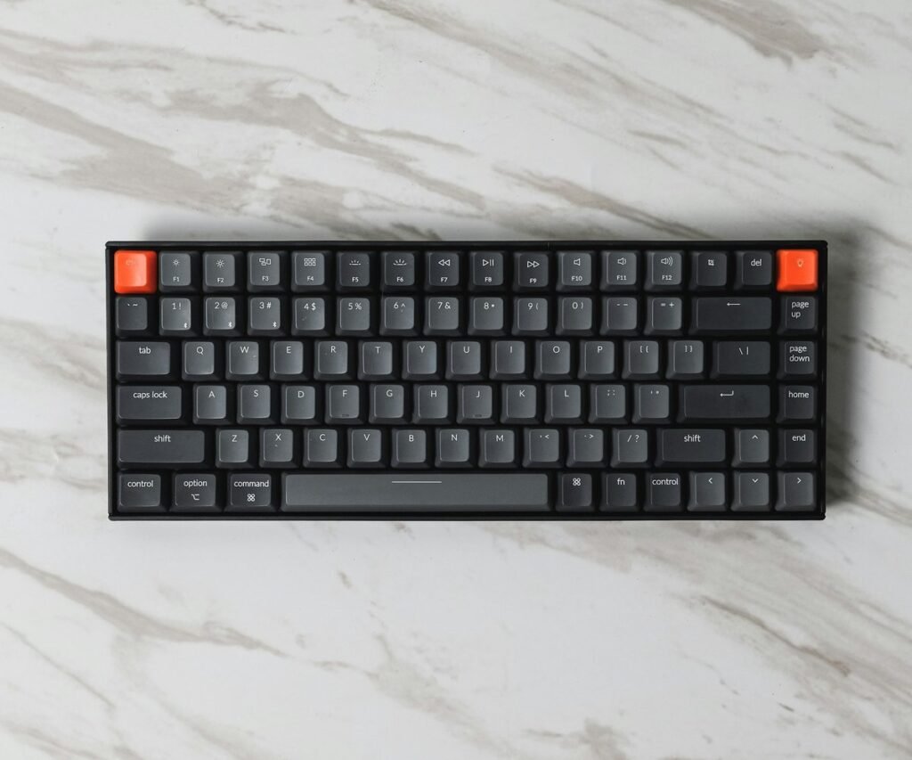 Low-profile mechanical keyboard on a white marble desk